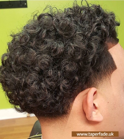 low taper fade wavy hair- 50 POPULAR TAPER FADE HAIRCUTS 2025